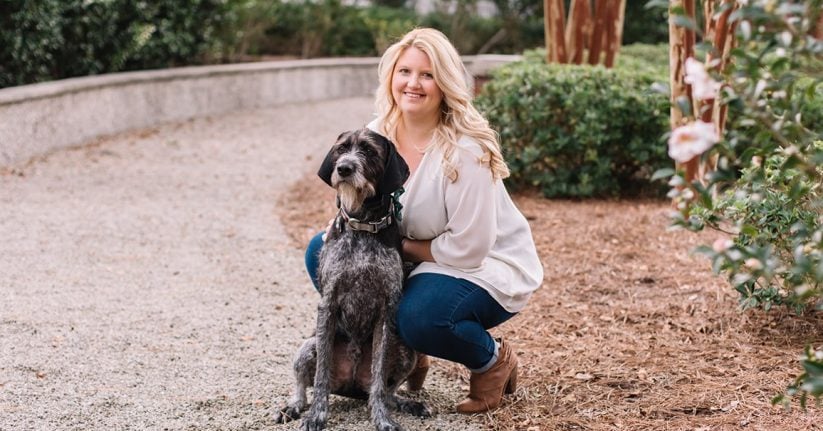 meghan dog owner posting with dog